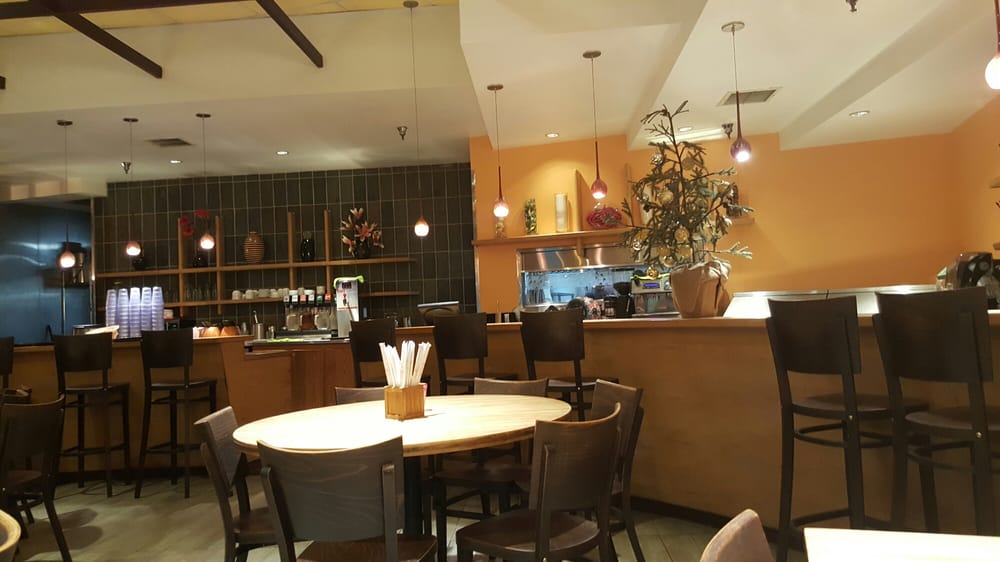 Dining room with a long counter and pendant lights